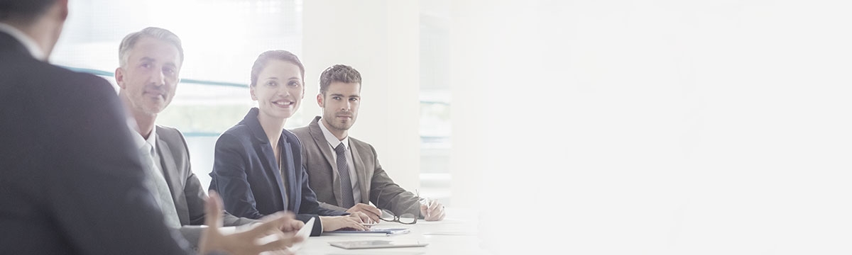 Image of people in a meeting. 