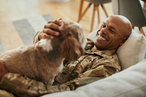 Man playing with dog