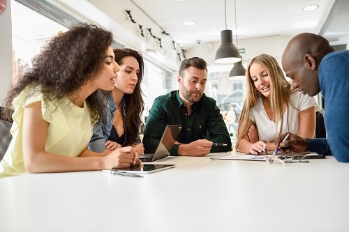 Diverse businesspeople meting together