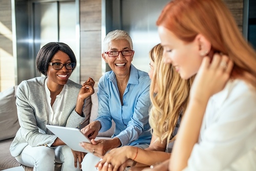 Diverse businesswomen meeting together