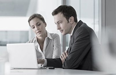 Man and woman at a laptop