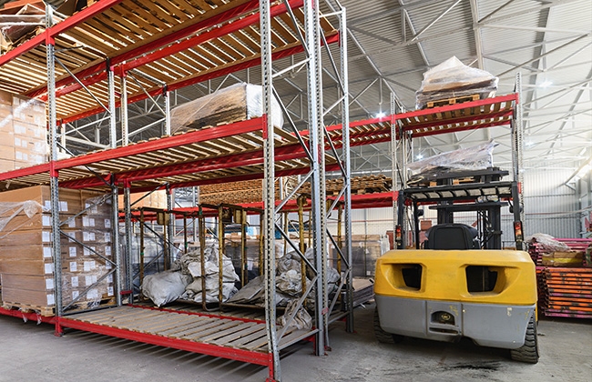 Forklift stocking warehouse