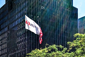 MUFG and American flag in front of building
