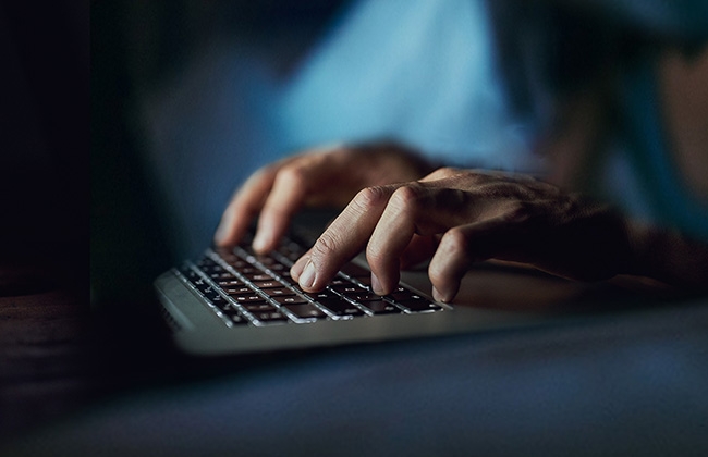 Hackers hands on keyboard